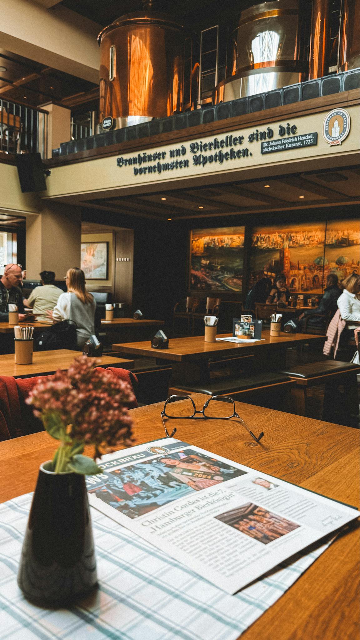 Warm brewery setting in Hamburg showcasing traditional decor and vibrant social atmosphere.